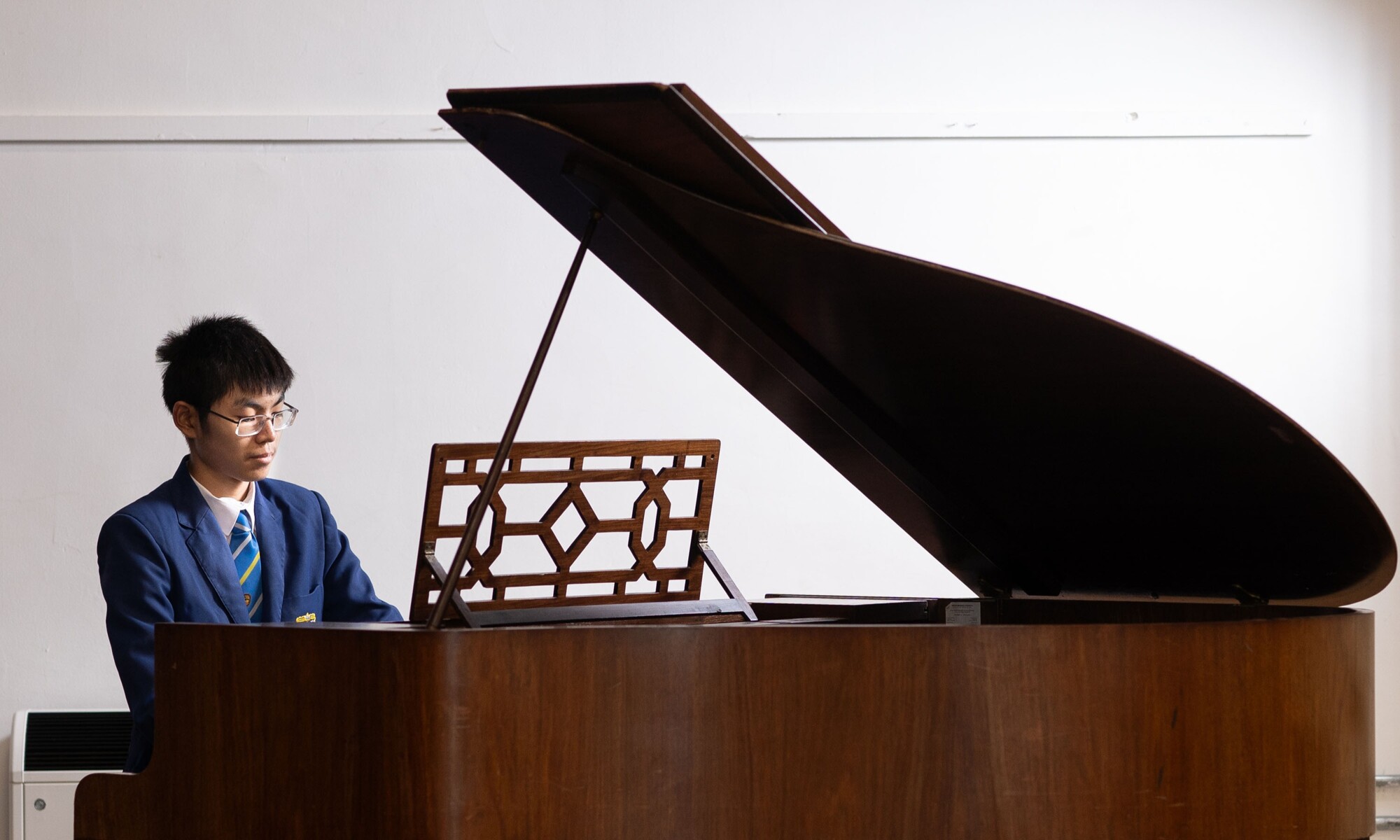 Student mastering the Piano