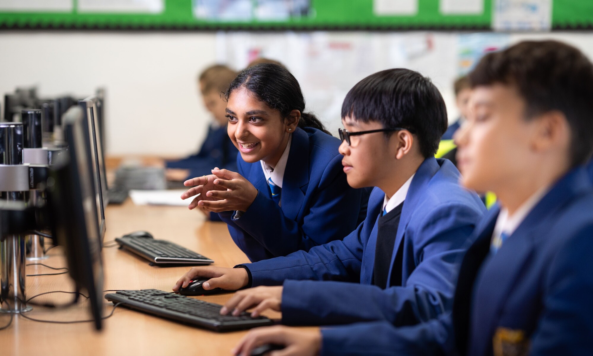 Students helping each-other in IT Class