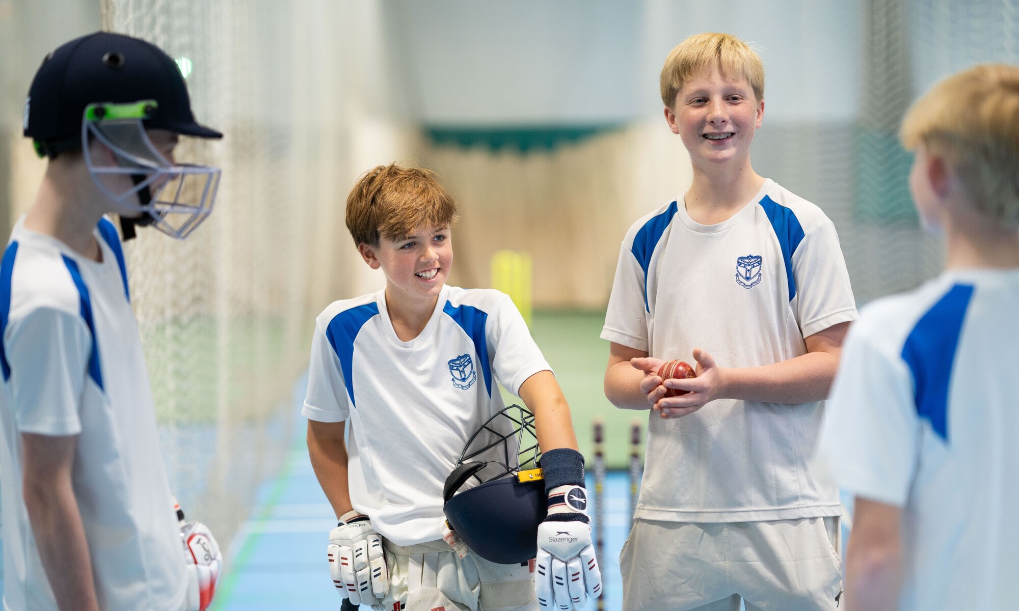 Students discussing training techniques for Cricket Sport