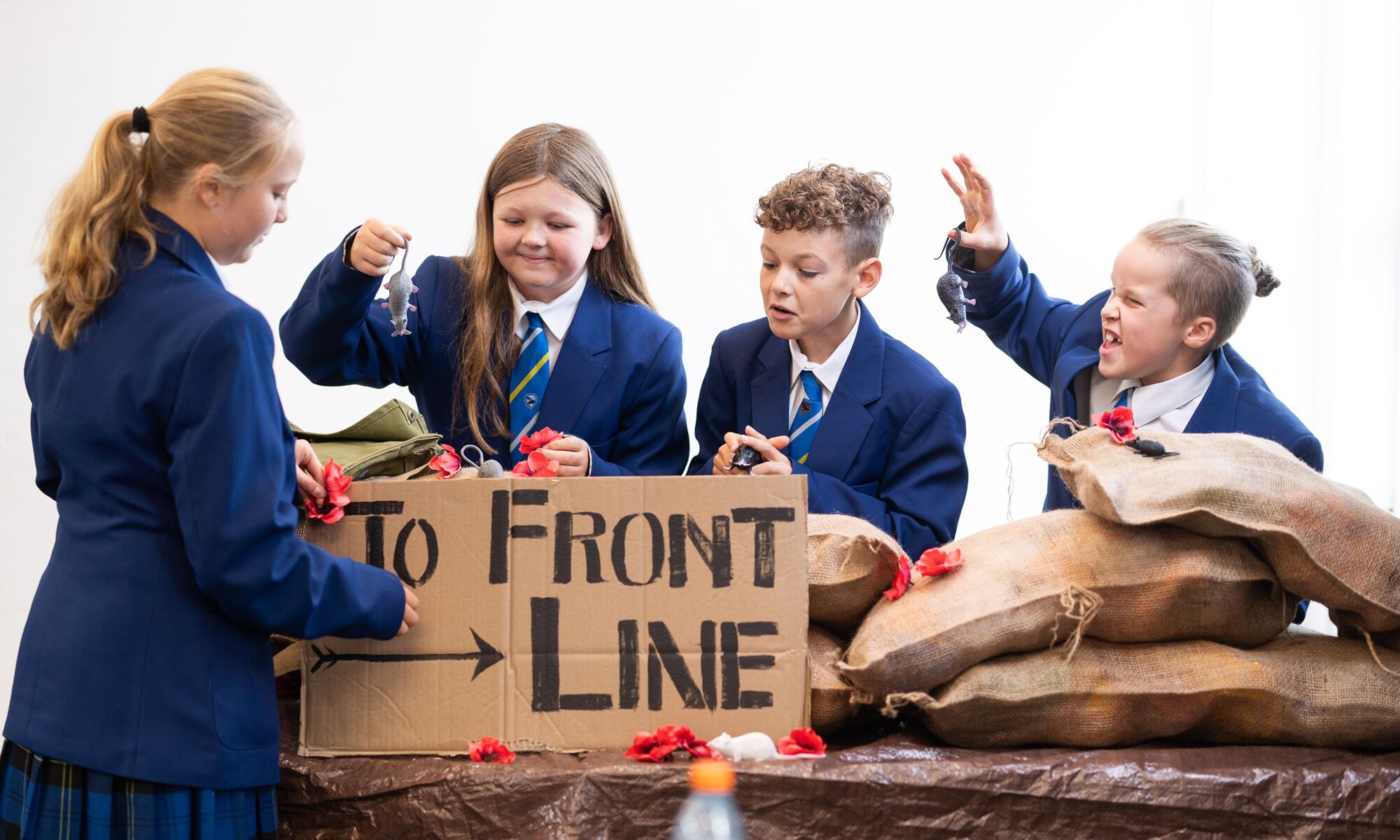 Students learning world history with physical objects from the past